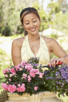 Royalty Free Photo of a Asian Woman in a Garden