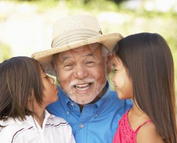 Royalty Free Photo of a Grandfather With His Grandchildren