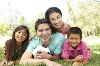 Royalty Free Photo of a Family With a Soccer Ball