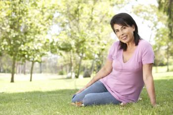 Royalty Free Photo of a Woman Sitting on Grass