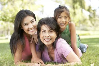 Royalty Free Photo of Three Generations of Women Lying on Grass