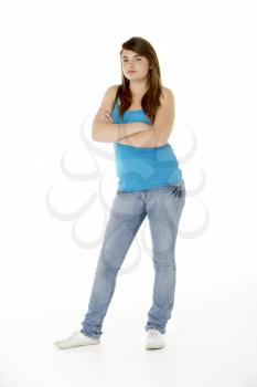 Royalty Free Photo of a Teenage Girl Standing With Her Arms Crossed
