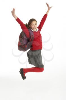 Royalty Free Photo of a Girl in a School Uniform Jumping