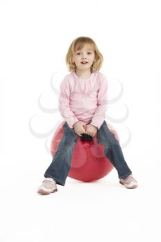 Young Girl Having Fun On Inflatable Hopper