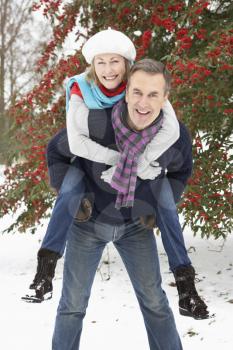 Royalty Free Photo of a Couple Having Fun in the Snow