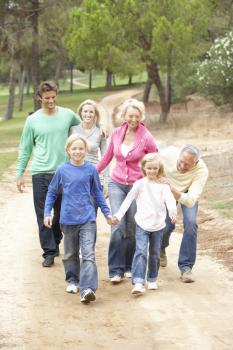Three Generation Family enjoying walk in park