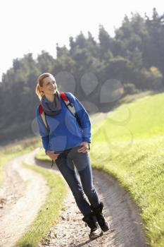 Young woman walks in park