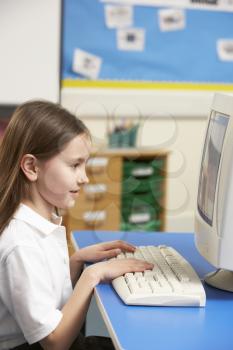 Schoolgirl In IT Class Using Computer