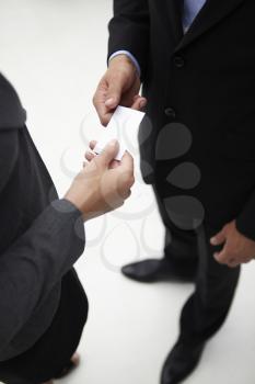Detail businessman and woman exchanging cards