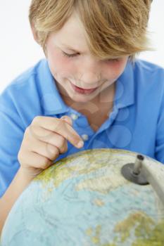 Young boy with globe
