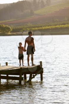Young man with child at sunset