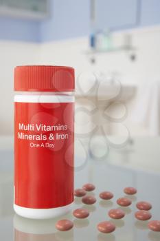 Vitamin pills on bathroom shelf
