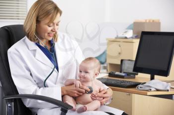 American doctor examining baby