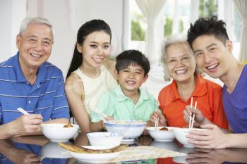 Portrait Of Multi-Generation Chinese Family Eating Meal Together