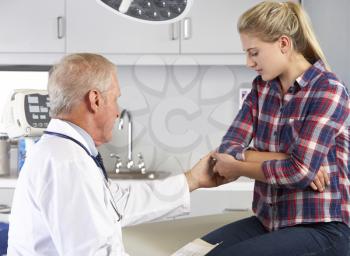 Teenage Girl Visits Doctor's Office With Elbow Pain
