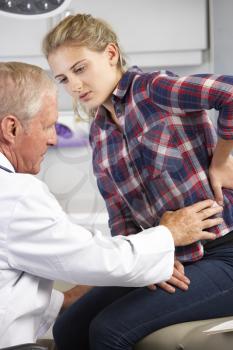 Teenage Girl Visits Doctor's Office With Back Pain