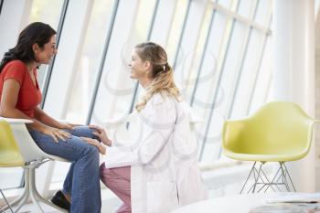 Female Doctor Offering Counselling To Depressed Woman