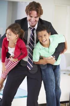 Children Greeting Father On Return From Work