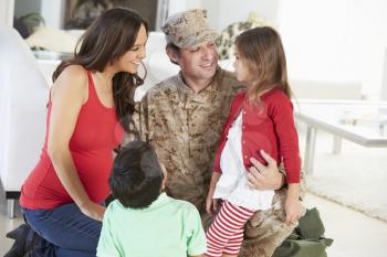 Family Greeting Military Father Home On Leave