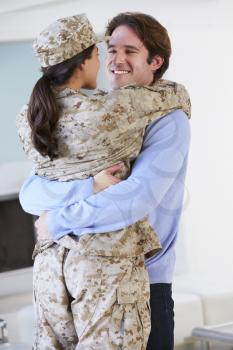 Husband Greeting Military Wife Home On Leave