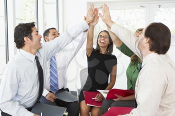 Business Team Giving One Another High Five