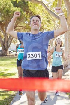 Male Runner Winning Marathon