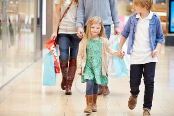 Children On Trip To Shopping Mall With Parents
