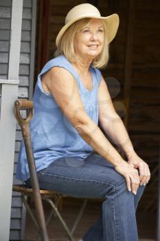 Senior woman sitting on veranda