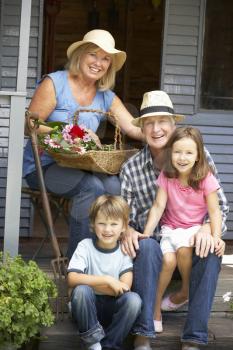 Senior couple on veranda with grandchildren