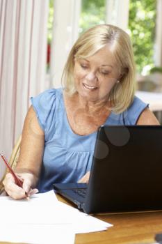 Senior Woman Working In Home Office
