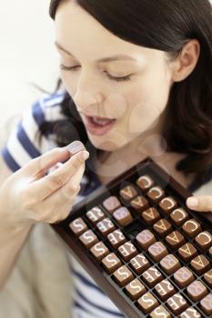 Woman eating chocolates