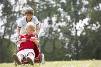 Young boys playing with go-kart