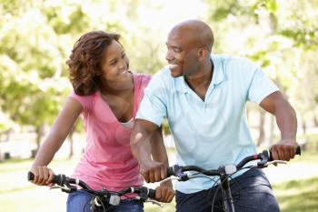 Young  couple cycling in park