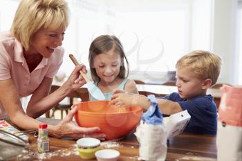 Grandmother And Grandchildren Baking Together At Home