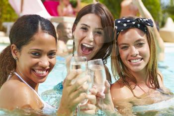 Three Women Having Party In Swimming Pool Drinking Champagne
