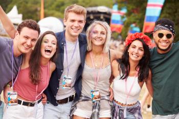 Group of friends hanging out together at a music festival