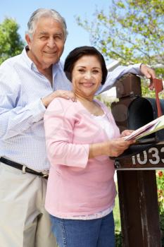 Senior Hispanic Couple Checking Mailbox