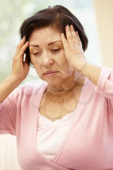 Senior Hispanic woman with headache