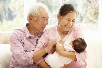 Asian grandparents with baby