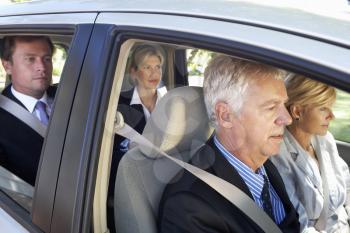 Group Of Business Colleagues Car Pooling Journey Into Work