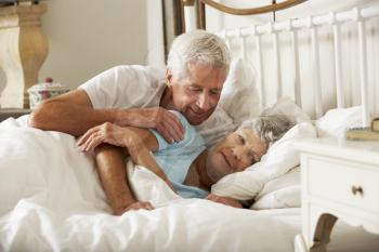 Senior Man Tries To Be Affectionate Towards Wife In Bed