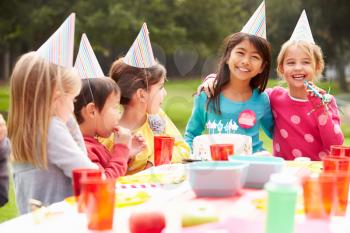 Group Of Children Having Outdoor Birthday Party