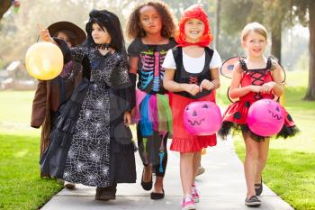 Children In Fancy Costume Dress Going Trick Or Treating