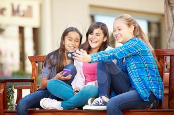 Group Of Girls Taking Selfie On Mobile Phone