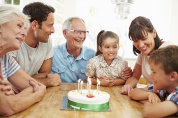 Multi Generation Family Celebrating Son's Birthday