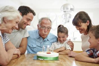 Multi Generation Family Celebrating Grandfather's Birthday