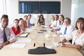 Point Of View Shot Of Businesspeople Around Boardroom Table