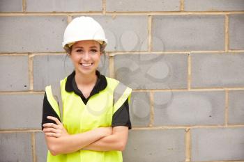 Portrait Of Female Construction Worker On Building Site