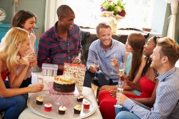 Group Of Friends Celebrating Birthday At Home Together
