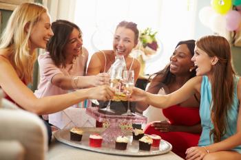 Female Friends Making A Toast To Celebrate Birthday
